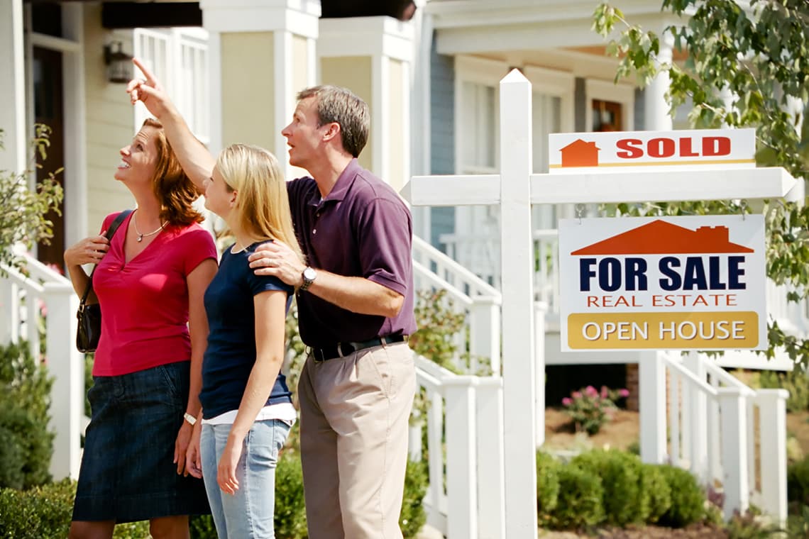 Family looking at house for sale