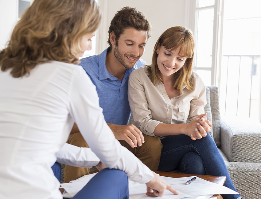 Couple signing mortgage contract